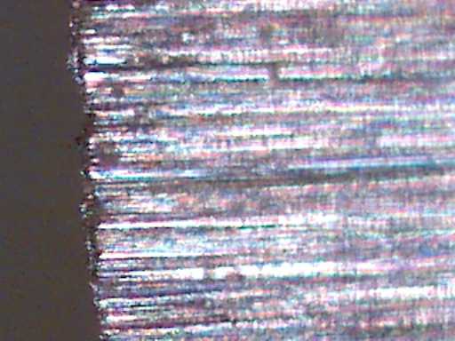 200x micrograph, radiused blade, 220 grit
