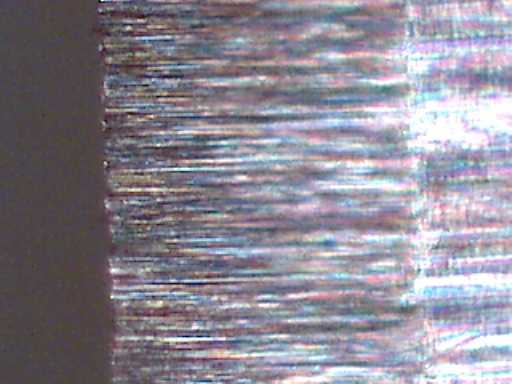 200x micrograph, radiused blade, 600 grit